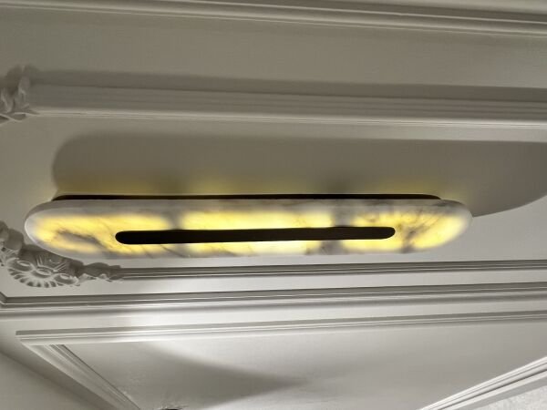 Elips Lazerli Mermer Aplik – Doğal Mermer ve Hassas Lazer Detaylarıyla Lüks Duvar Aydınlatması